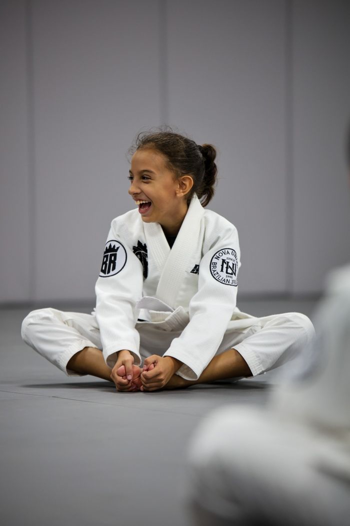 A young student smiling during a Brabus Academy Jiu-Jitsu class